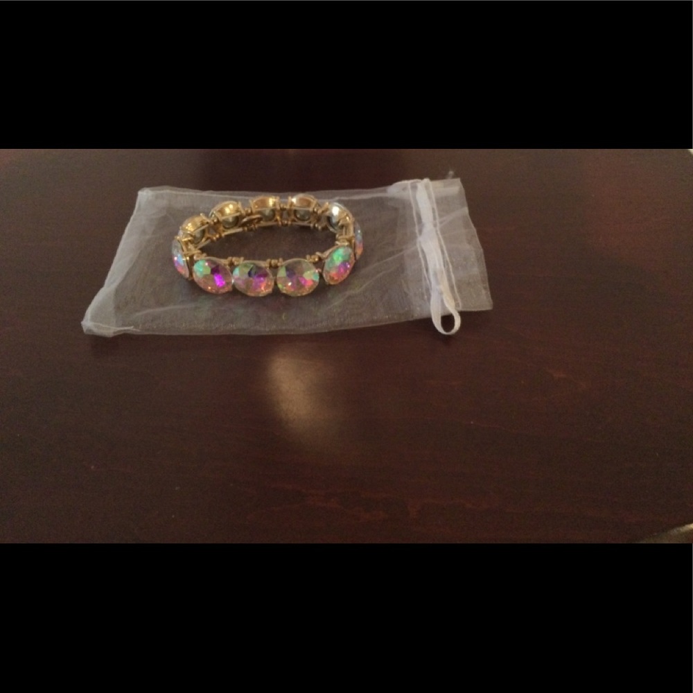 Wren iridescent crystal stones set in gold tone